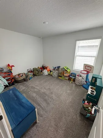 a room with gym equipment and toys