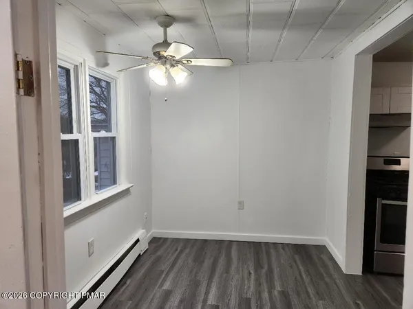 a view of an empty room and window