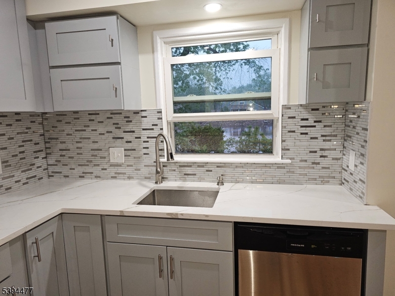 38 Riverview Circle Little Falls, NJ 07424 - Photo 2 of 4 a sink with a window