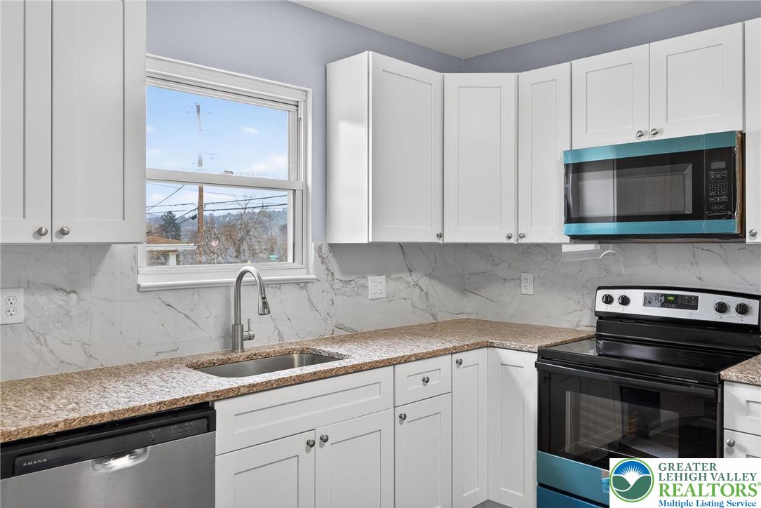 2375 East Lizard Creek Road Lehighton, PA 18235 - Photo 13 of 42 a kitchen with appliances a sink and cabinets