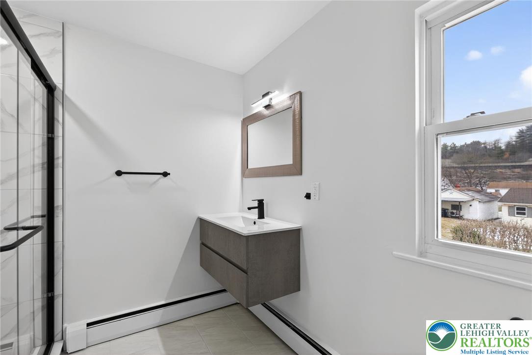 2375 East Lizard Creek Road Lehighton, PA 18235 - Photo 22 of 42 a bathroom with a sink and mirror
