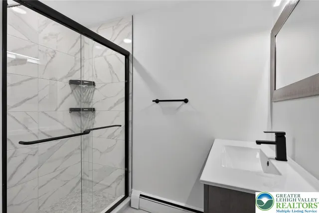 a bathroom with a sink and mirror