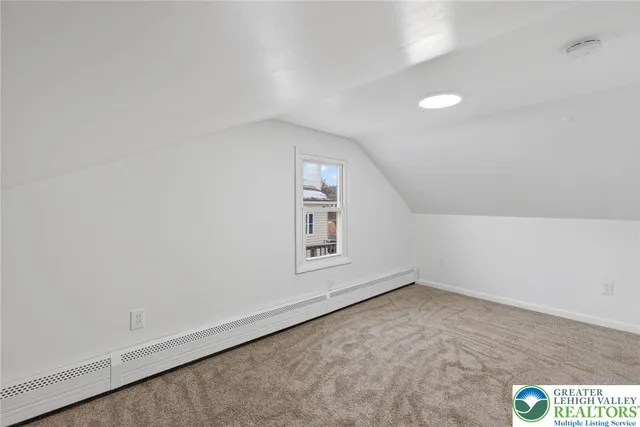 an empty room with a empty space and window