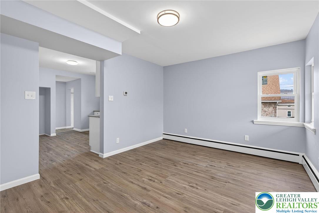 2375 East Lizard Creek Road Lehighton, PA 18235 - Photo 7 of 42 an empty room with wooden floor and windows