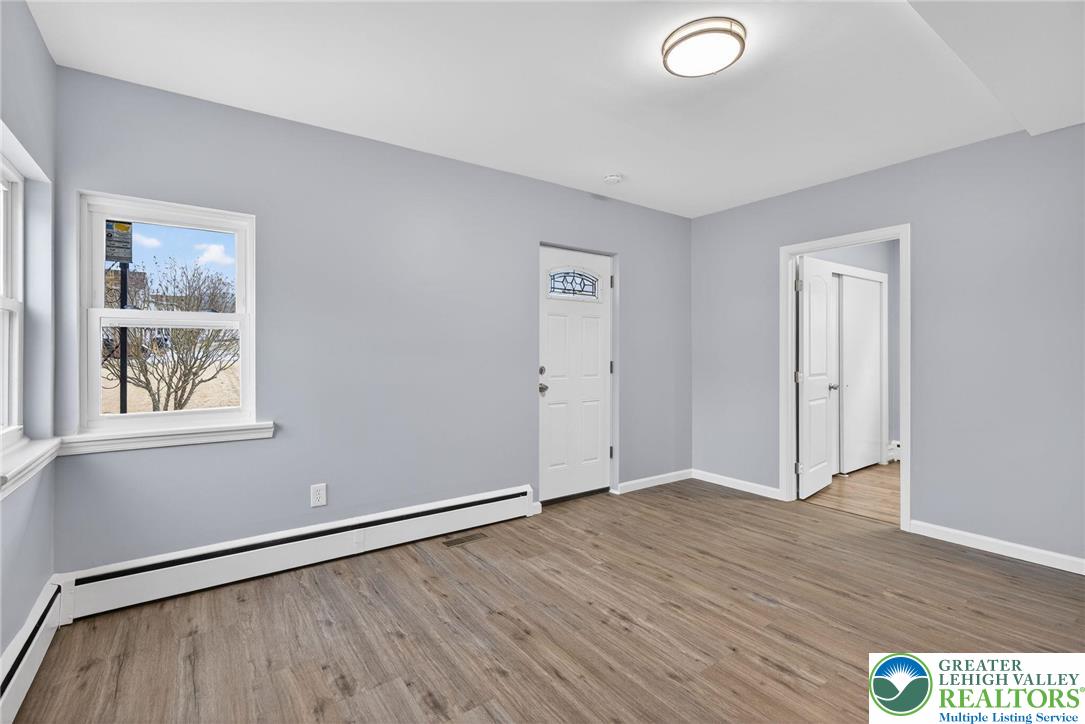 2375 East Lizard Creek Road Lehighton, PA 18235 - Photo 9 of 42 an empty room with wooden floor and windows