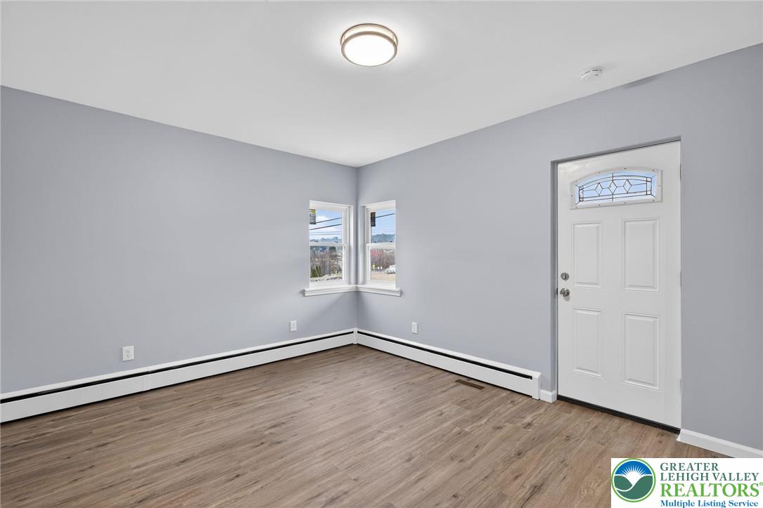 2375 East Lizard Creek Road Lehighton, PA 18235 - Photo 10 of 42 an empty room with wooden floor and windows