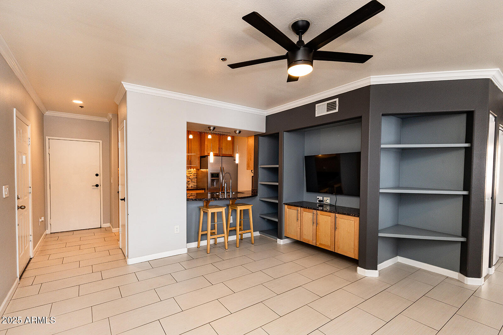 2134 East Broadway Road, Unit 1016 Tempe, AZ 85282 - Photo 11 of 33 a living room with furniture and a flat screen tv
