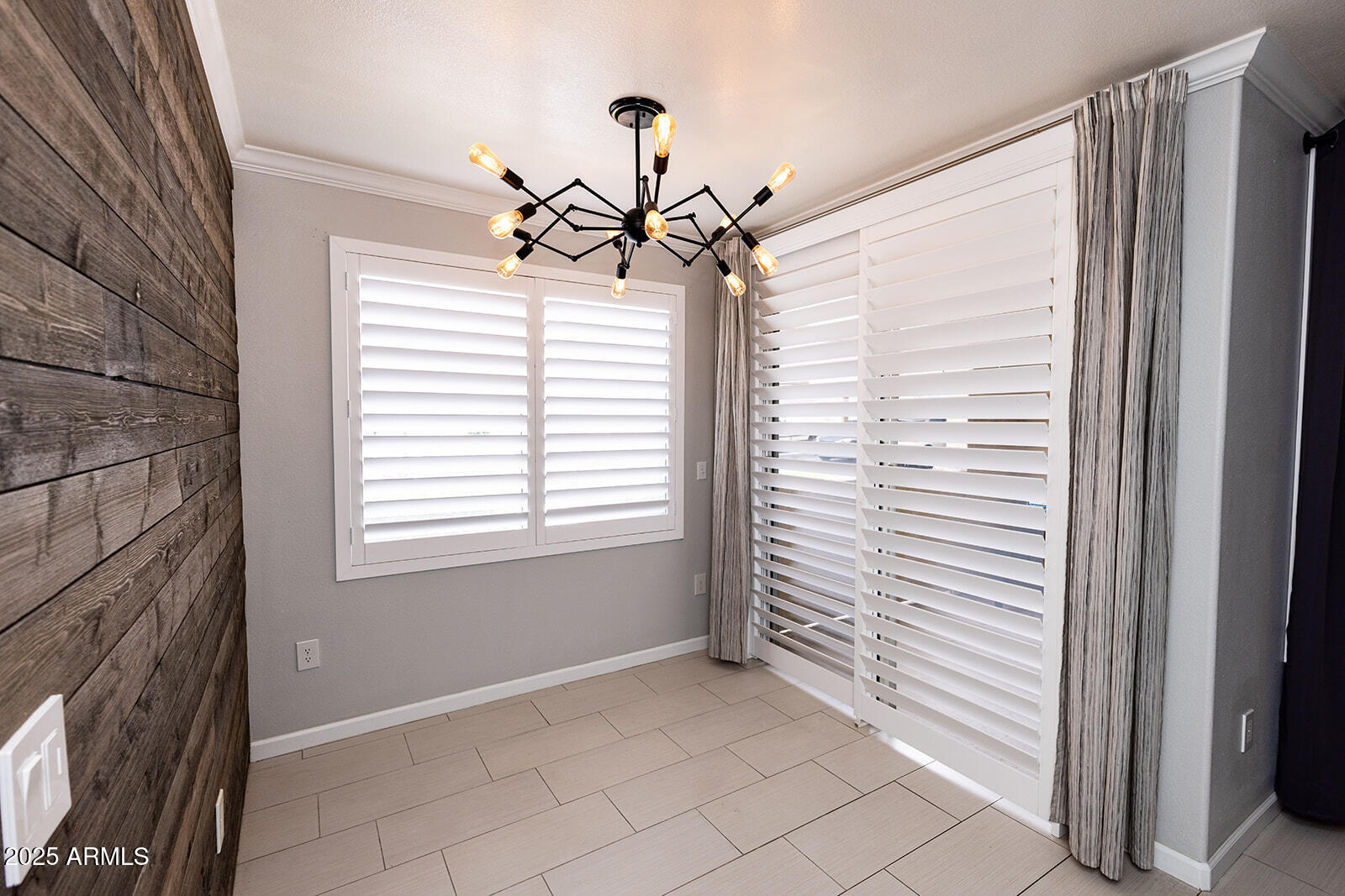 2134 East Broadway Road, Unit 1016 Tempe, AZ 85282 - Photo 14 of 33 a view of a livingroom with a chandelier fan and windows