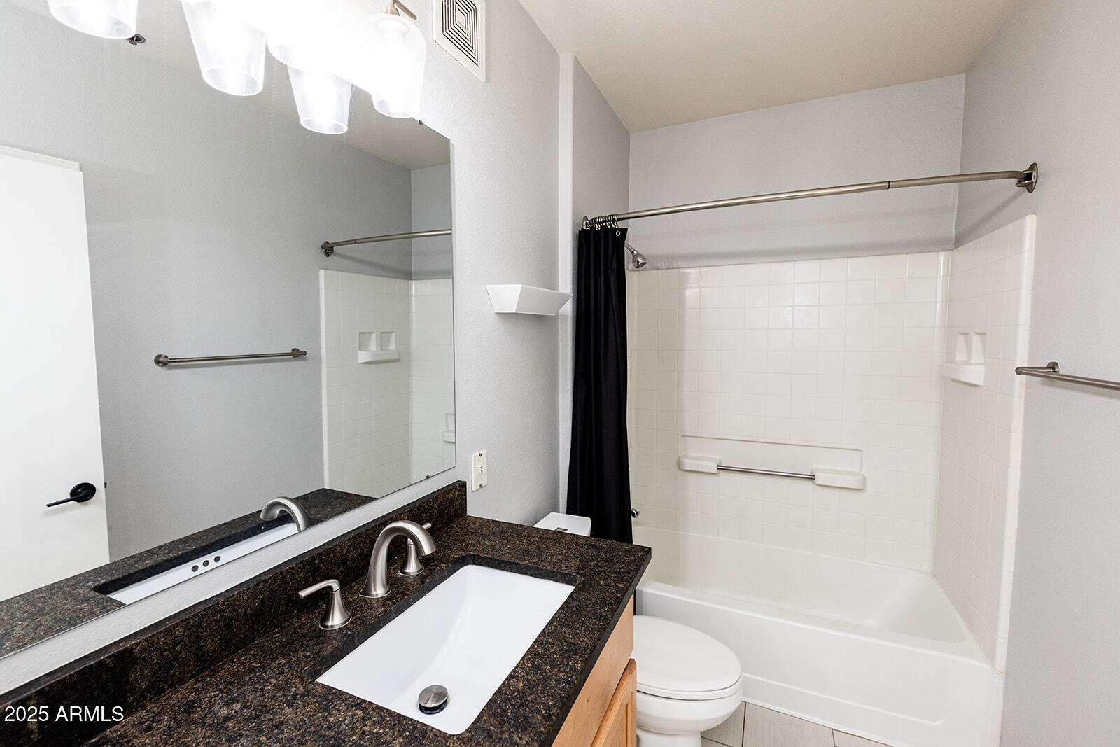 2134 East Broadway Road, Unit 1016 Tempe, AZ 85282 - Photo 19 of 33 a bathroom with a sink a toilet and shower