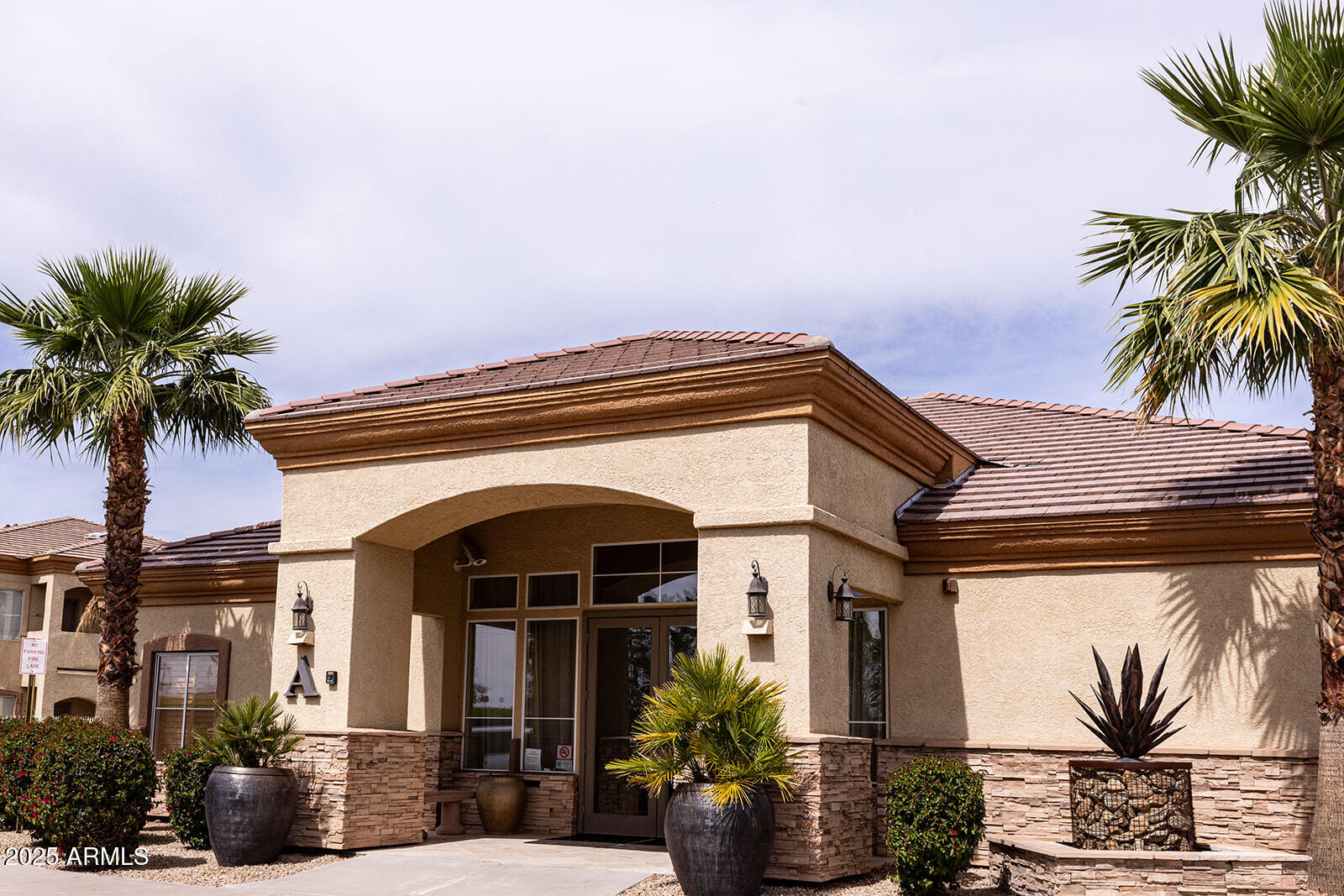 2134 East Broadway Road, Unit 1016 Tempe, AZ 85282 - Photo 33 of 33 a front view of a house with a yard