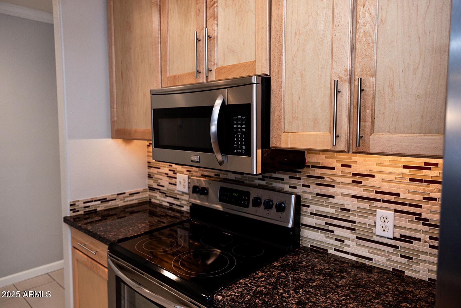 2134 East Broadway Road, Unit 1016 Tempe, AZ 85282 - Photo 7 of 33 a kitchen with stainless steel appliances a stove and a microwave
