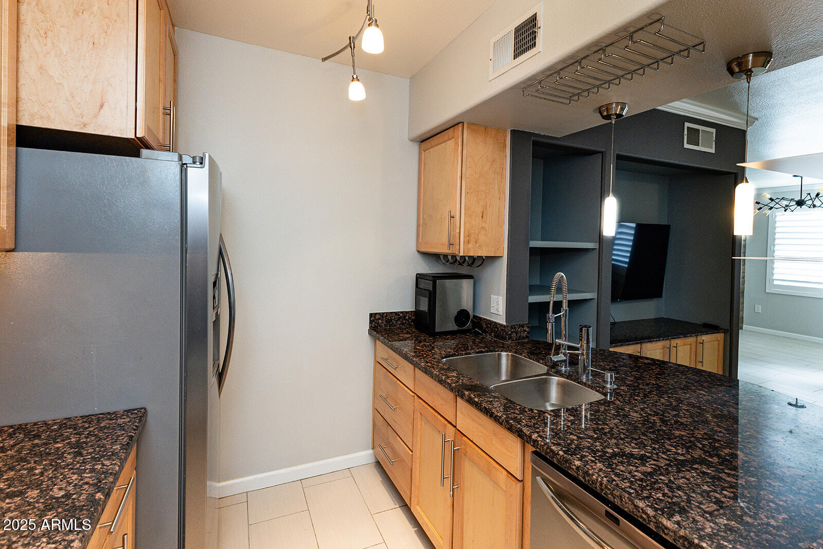 2134 East Broadway Road, Unit 1016 Tempe, AZ 85282 - Photo 8 of 33 a kitchen with stainless steel appliances granite countertop a sink stove and refrigerator