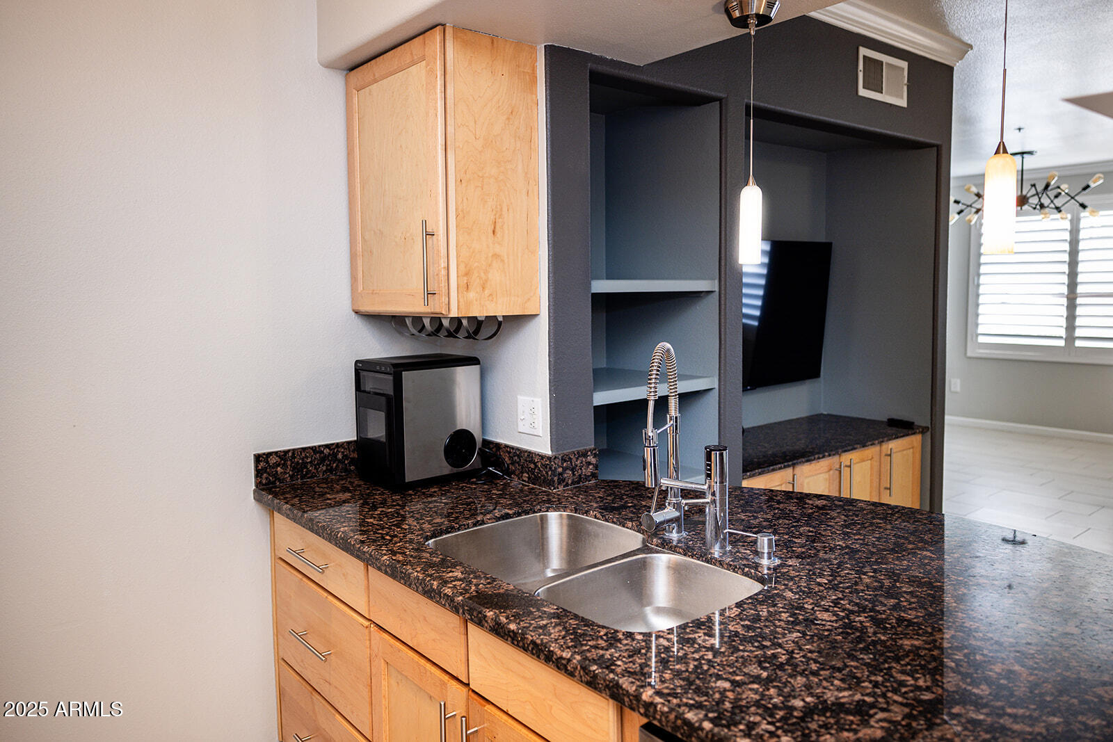 2134 East Broadway Road, Unit 1016 Tempe, AZ 85282 - Photo 9 of 33 a kitchen with granite countertop a sink and a stove