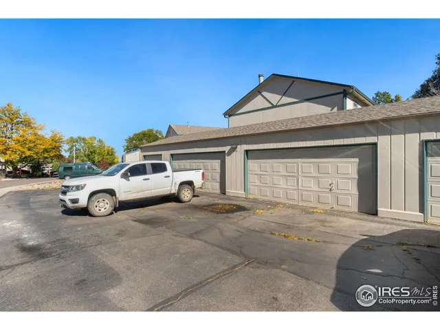 a view of a car parked in front of a house