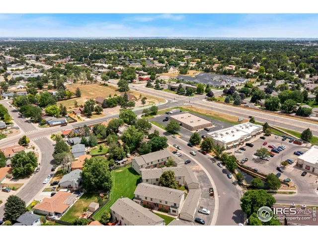 an aerial view of residential houses with city view