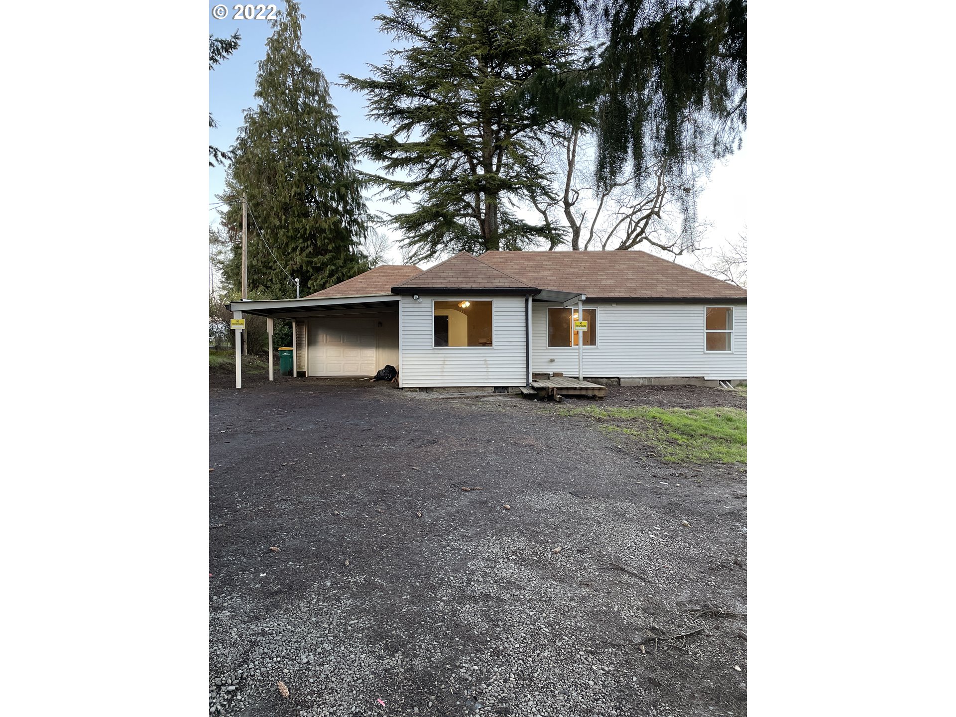 1121 Gales Creek Road Forest Grove, OR 97116 - Photo 1 of 4 a front view of a house with a garden