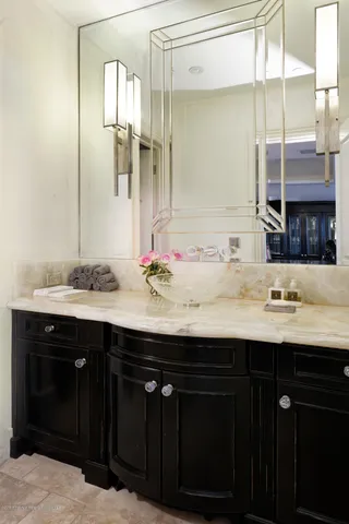 a bathroom with a sink double vanity and a mirror