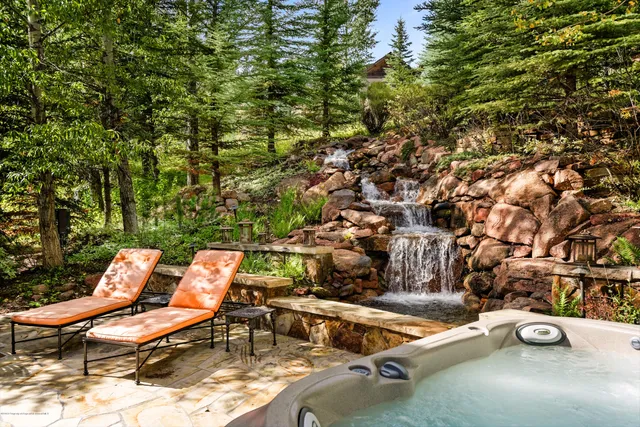 a view of a chairs and table in the patio