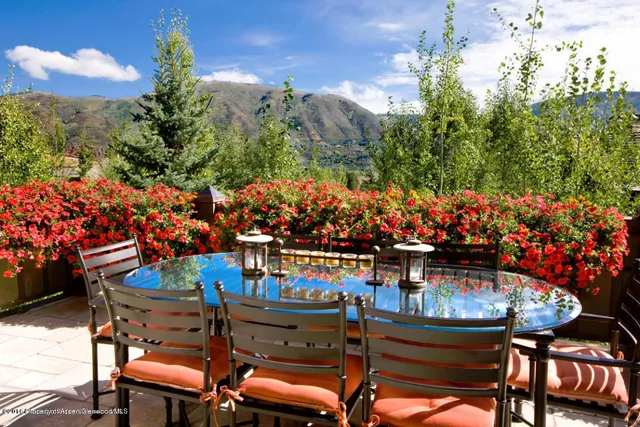 a view of a chairs and table in the outdoor space