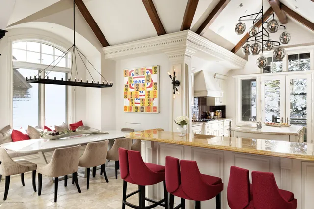 a dining room with furniture and window