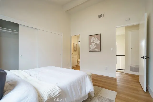 a bathroom with a shower sink vanity mirror and toilet