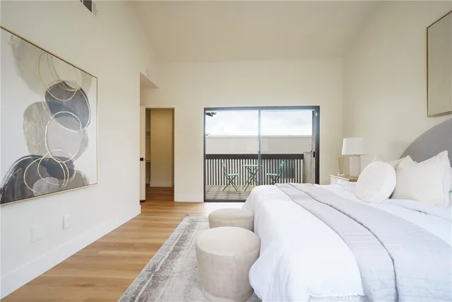 a spacious bathroom with a double vanity sink a mirror and a bathtub