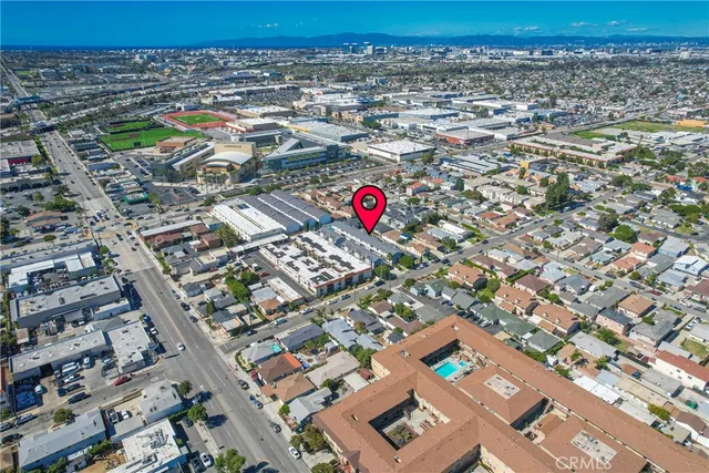an aerial view of residential houses with yard