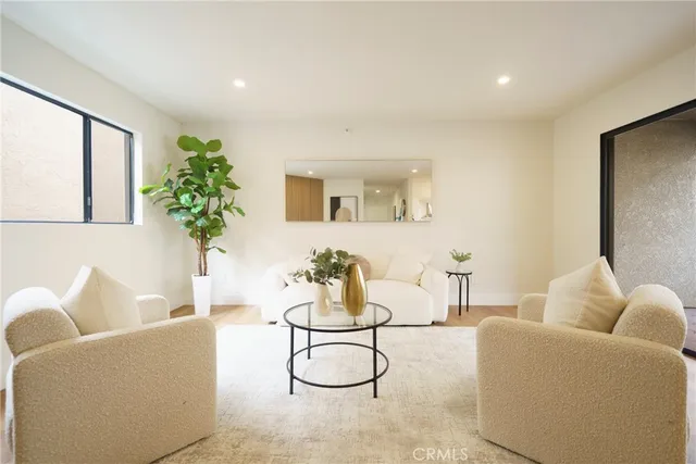 a living room with furniture and white walls