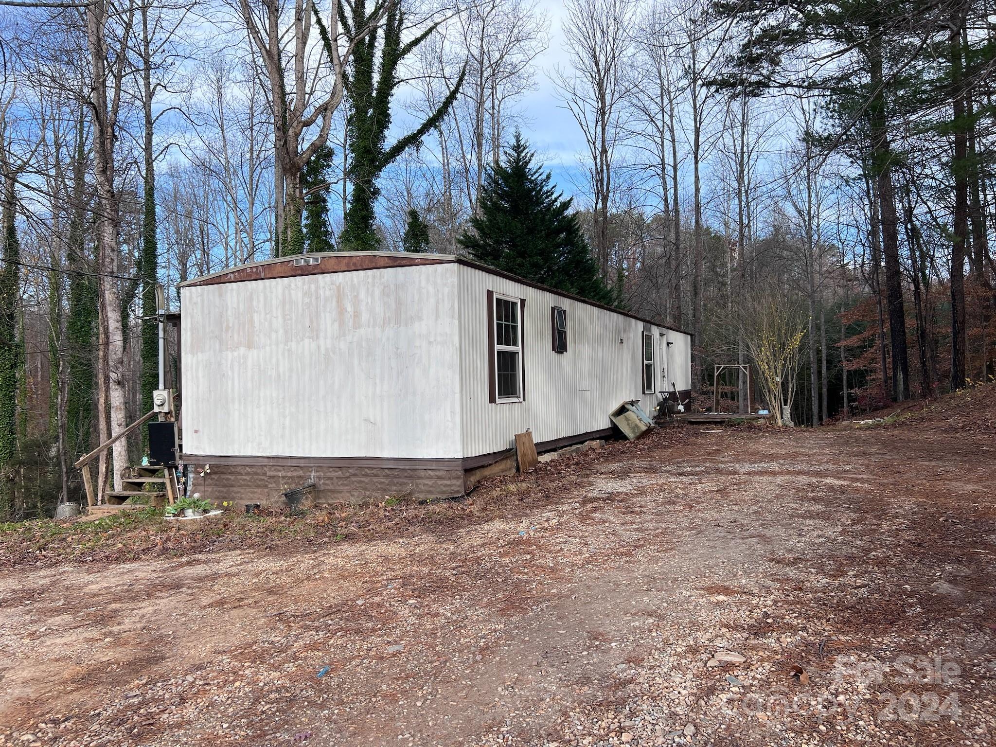 139 Pleasant Hill Road Marion, NC 28752 - Photo 6 of 18 a view of a house with backyard