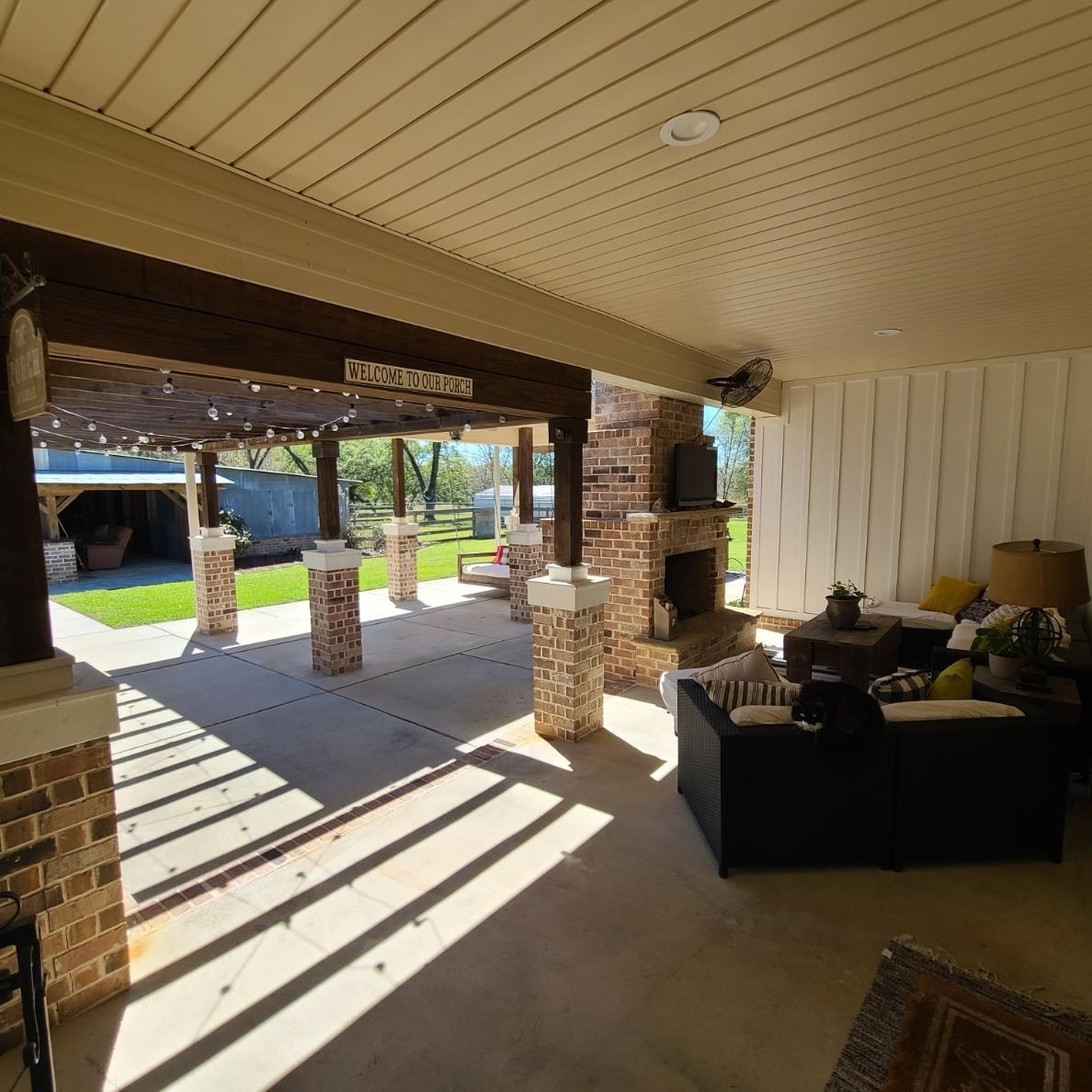 10051 Blackwell Nursery Road Semmes, AL 36575 - Photo 24 of 54 View of patio with an outdoor living space with a fireplace
