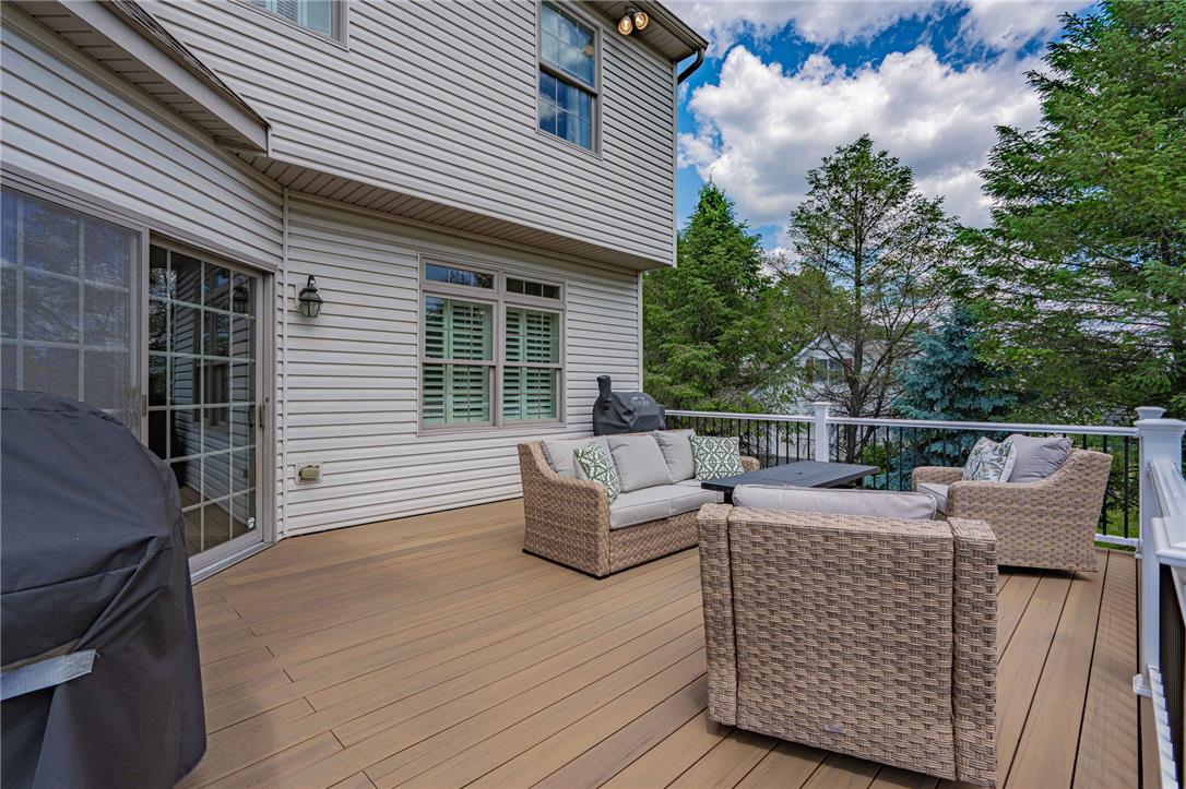 6000 Pond View Terrace Bath, PA 18014 - Photo 52 of 69 An inviting outdoor deck provides ample space for relaxation and entertaining amidst verdant surroundings.