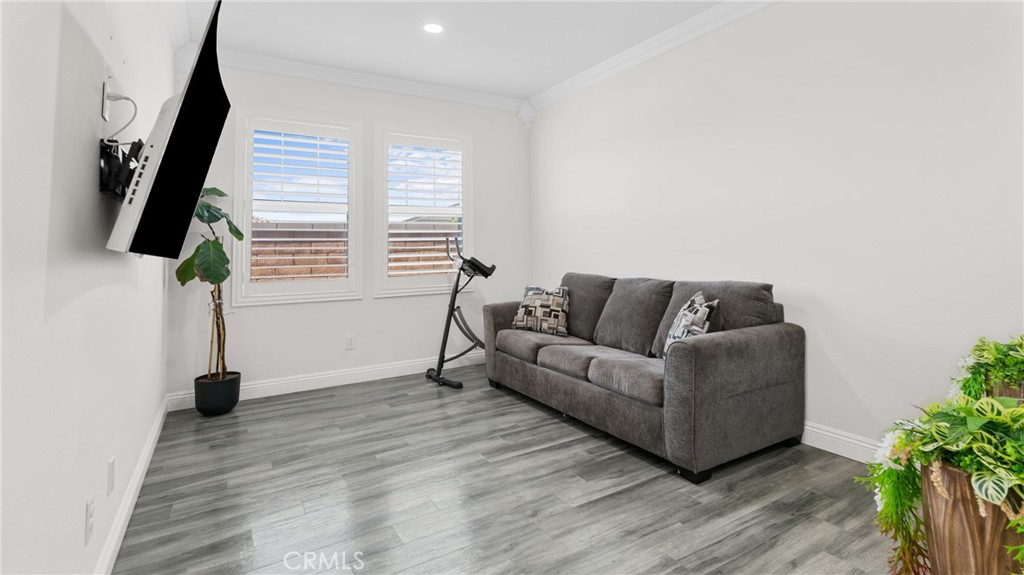 19743 Clementine Court Riverside, CA 92507 - Photo 11 of 31 a living room with furniture and a flat screen tv