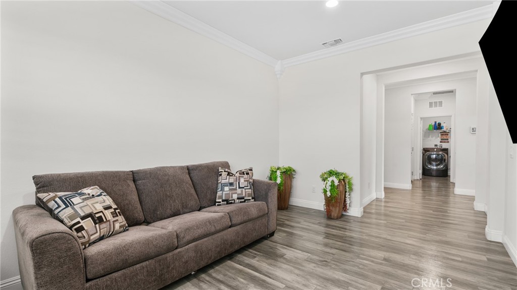 19743 Clementine Court Riverside, CA 92507 - Photo 12 of 31 a living room with furniture and wooden floor
