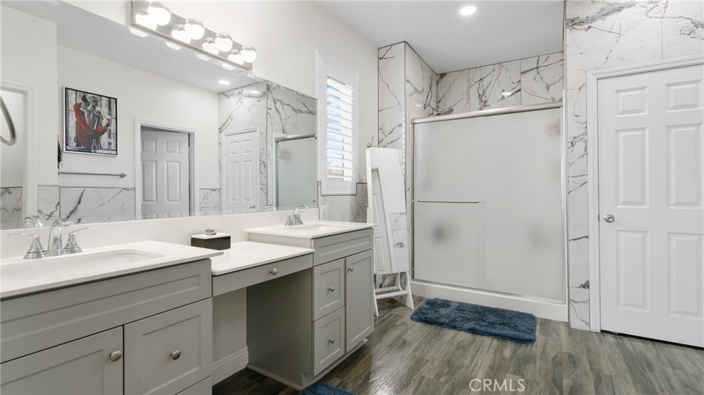 19743 Clementine Court Riverside, CA 92507 - Photo 17 of 31 a bathroom with a sink double vanity and a mirror