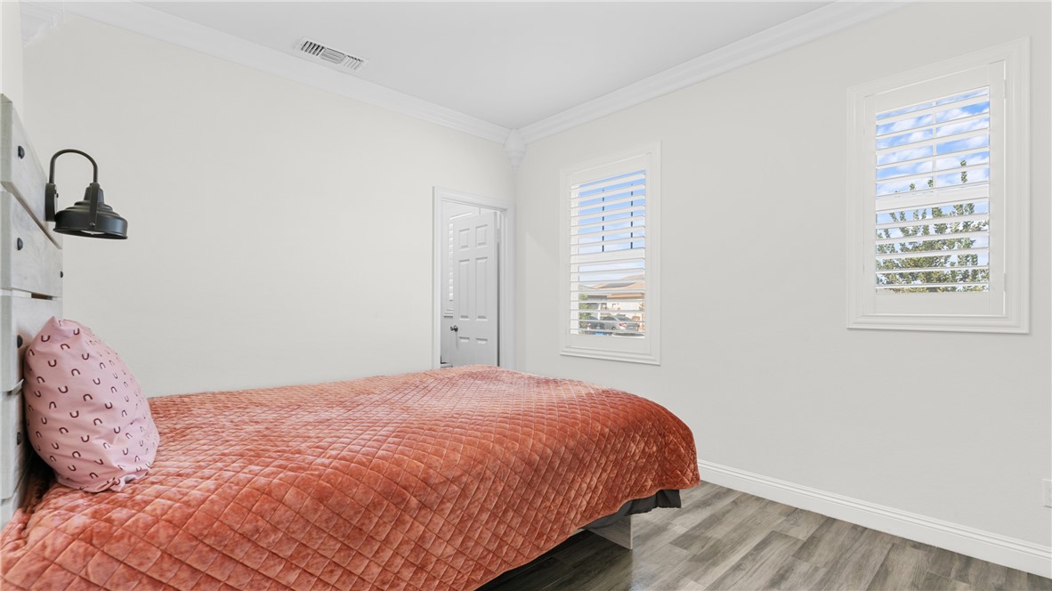 19743 Clementine Court Riverside, CA 92507 - Photo 20 of 31 a bedroom with a bed and a window