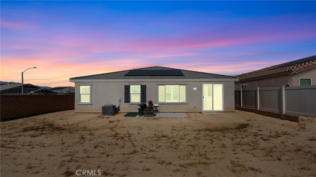 19743 Clementine Court Riverside, CA 92507 - Photo 23 of 31 a front view of a house with a yard