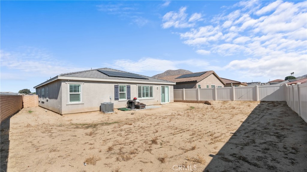 19743 Clementine Court Riverside, CA 92507 - Photo 25 of 31 a view of a house with a yard