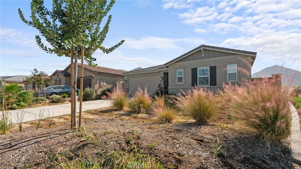 19743 Clementine Court Riverside, CA 92507 - Photo 26 of 31 a front view of a house with garden