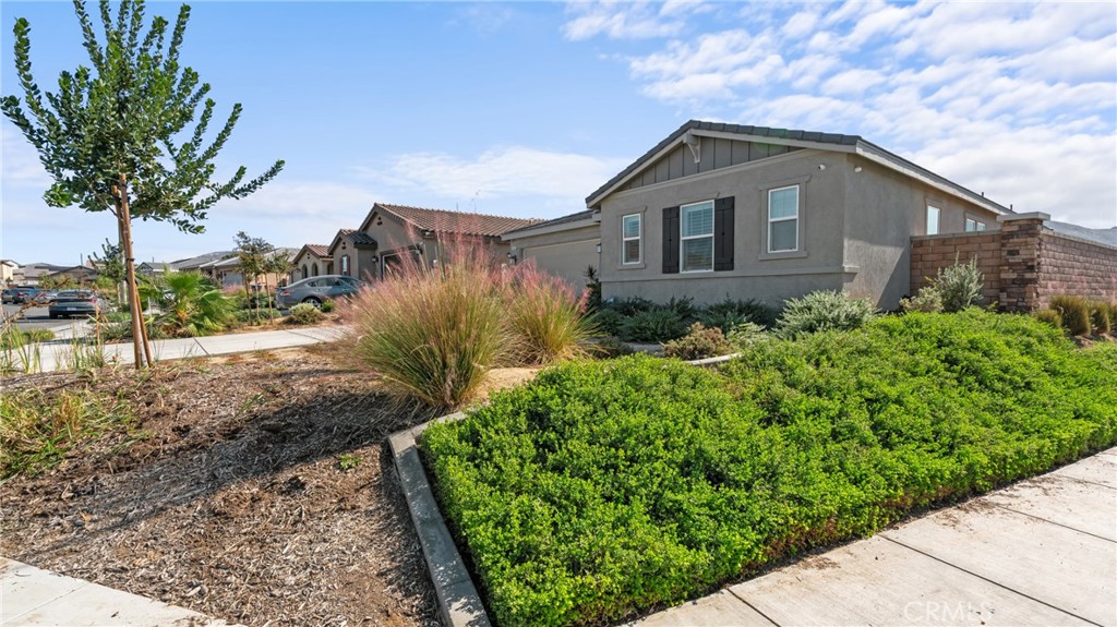 19743 Clementine Court Riverside, CA 92507 - Photo 27 of 31 a front view of a house with a yard