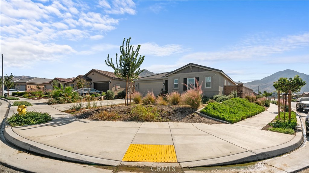 19743 Clementine Court Riverside, CA 92507 - Photo 28 of 31 a front view of a house with garden