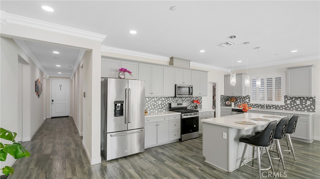 19743 Clementine Court Riverside, CA 92507 - Photo 4 of 31 a kitchen with a sink and refrigerator