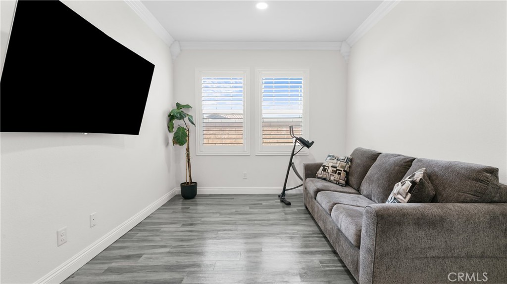 19743 Clementine Court Riverside, CA 92507 - Photo 10 of 31 a living room with furniture and a flat screen tv