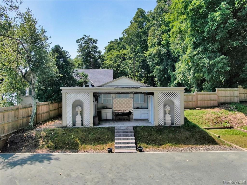 67 River Road Nyack, NY 10960 - Photo 45 of 47 a front view of a house with a yard