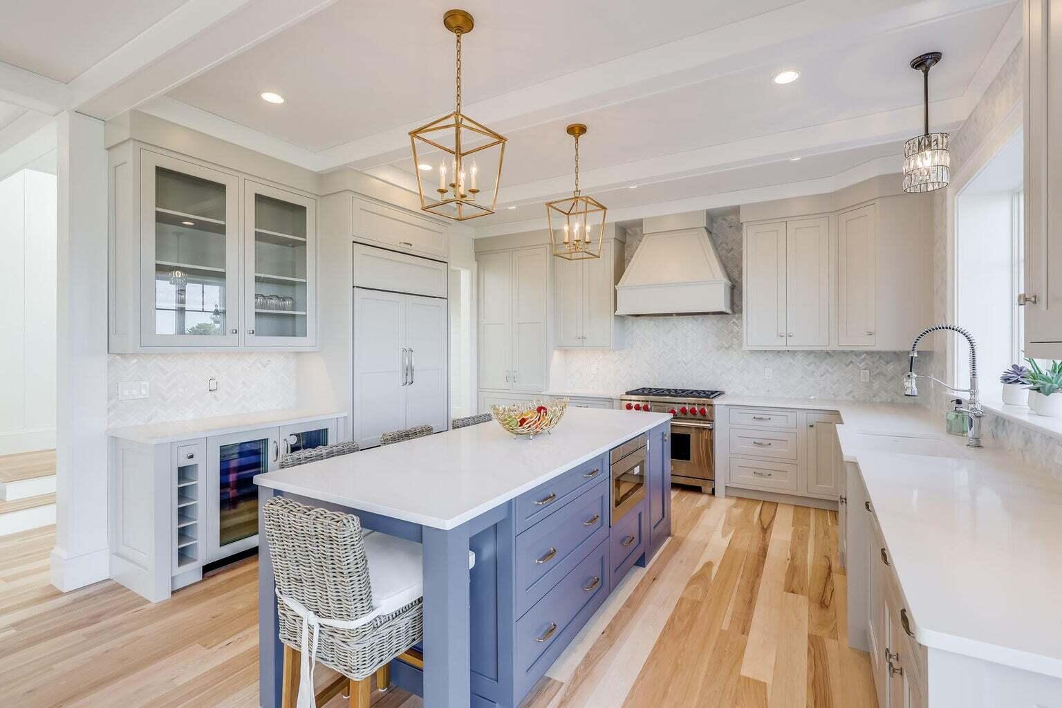 14 Pond View Lane Chatham, MA 02633 - Photo 18 of 30 a kitchen with kitchen island a sink stove and wooden floor