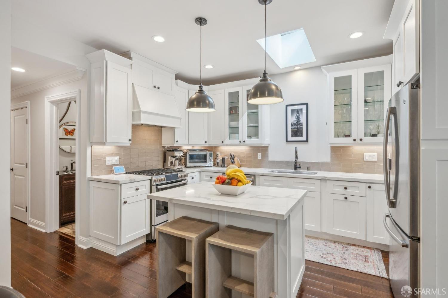 226 Roosevelt Way San Francisco, CA 94114 - Photo 21 of 65 a kitchen with stainless steel appliances granite countertop a sink stove and refrigerator