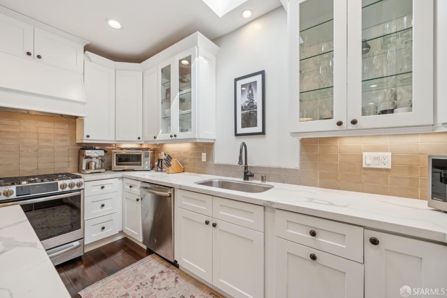 226 Roosevelt Way San Francisco, CA 94114 - Photo 23 of 65 a kitchen with granite countertop stainless steel appliances white cabinets and a sink