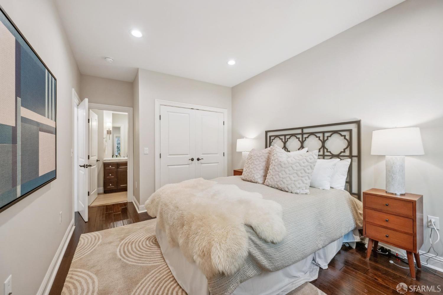 226 Roosevelt Way San Francisco, CA 94114 - Photo 30 of 65 a bedroom with a bed and wooden floor