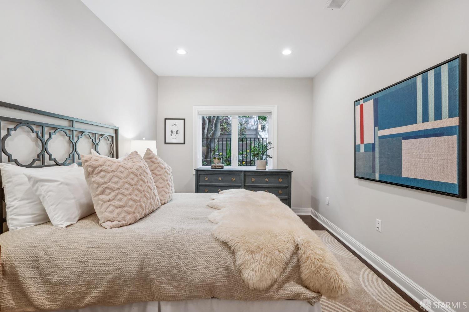 226 Roosevelt Way San Francisco, CA 94114 - Photo 32 of 65 a bedroom with a large bed and a window