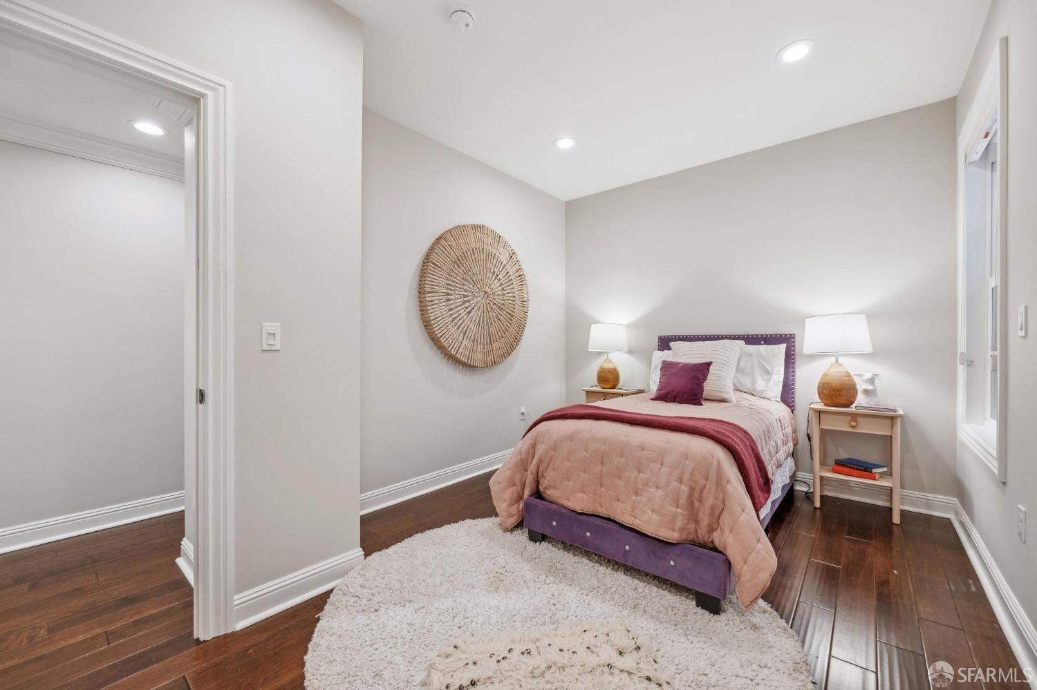 226 Roosevelt Way San Francisco, CA 94114 - Photo 36 of 65 a bedroom with a bed and wooden floor