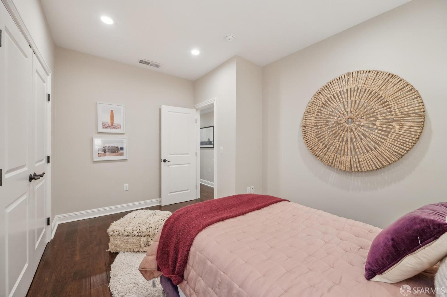 226 Roosevelt Way San Francisco, CA 94114 - Photo 37 of 65 a bedroom with a bed and a chandelier